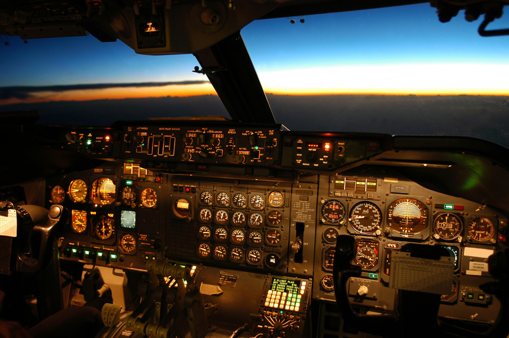 Cockpit Of Airplane And Sunset In The Distance